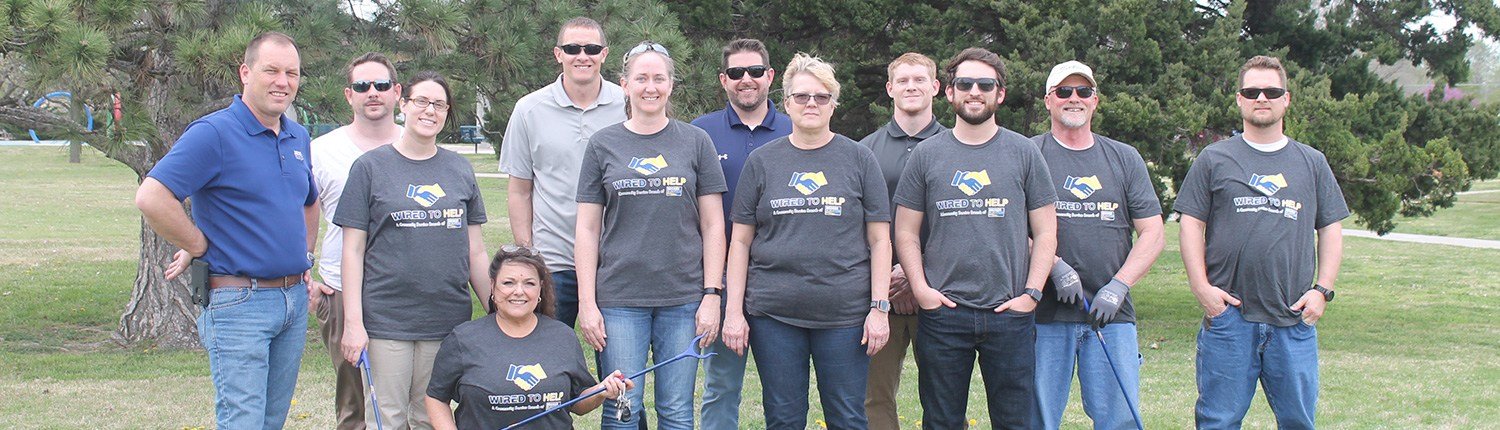 12 Decker Electric staff members at Osage Park in Wichita volunteering to clean up trash and make city park pretty